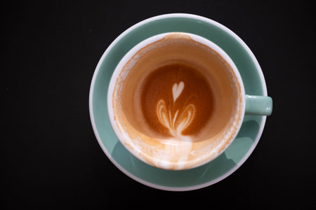 an Empty Cup of latte art Coffee with heart Stain after finishの写真素材