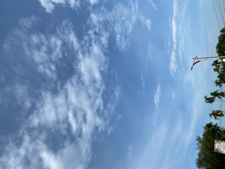 Blue sky background with white clouds. Cloudy blue sky background.の写真素材