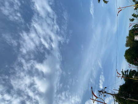 Clouds in the blue sky as a background, with space for textの写真素材