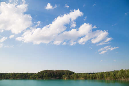 A beautiful lake with rock and forest in the village of Cherepashino. Ukraineの写真素材