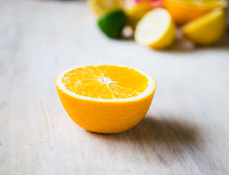 citrus fruits (grapefruit, orange, lemon, lime), top view on the wooden background.の写真素材