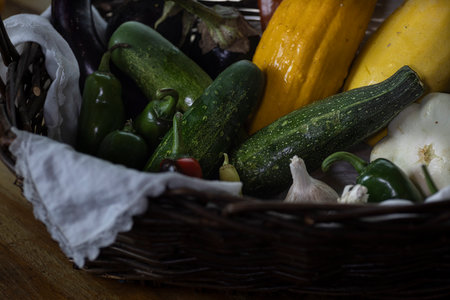 Basket full of various types of fresh summer vegetables.の写真素材