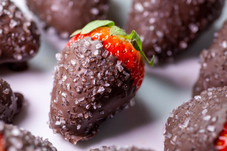 Chocolate dipped strawberries sprinkled with sugar crystals.の写真素材