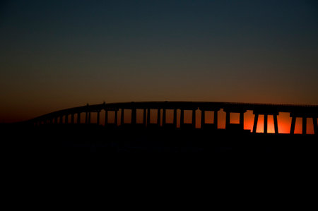 Sunset over the bridge in the Rigolets.の写真素材