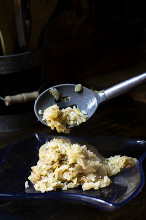 Shredded hash browns plated on blue plate.の写真素材