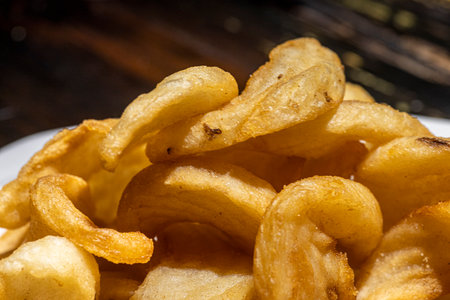 Thick cut curly french fries.