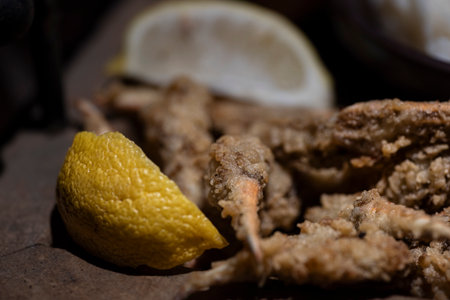 Fried crab fingers with lemon slices.