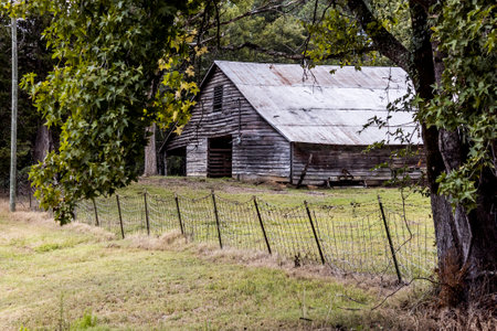 Old weathered horse barn in the country.の写真素材