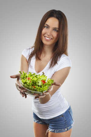 Healthy lovely woman with saladの写真素材
