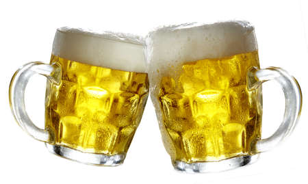 Pair of beer glasses making a toastの写真素材