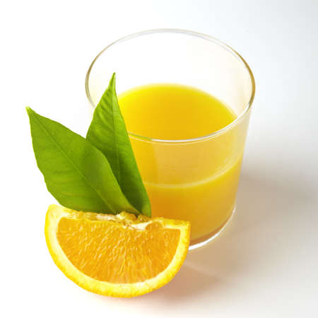 Orange juice and slices of orangeの写真素材