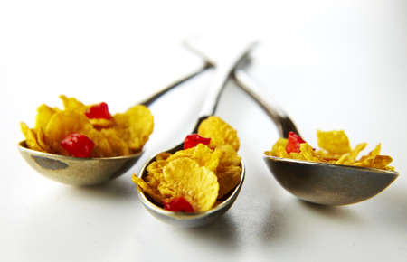 Cereals and strawberries in spoonの写真素材