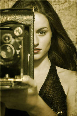 Glamour woman with camera  retro styleの写真素材