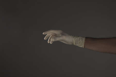 hand with glove on studioの写真素材