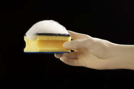 still life of a scourer and a latex glove