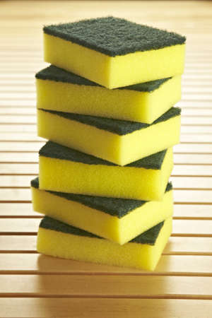 6 sponges to clean dishes stacked in the kitchenの写真素材