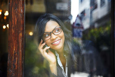 calling with a mobile phone の写真素材