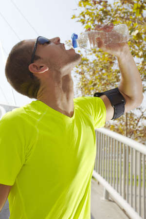 Man drinking water after work out の写真素材