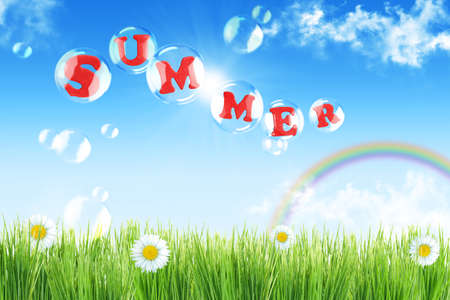 Summer landscape with flowers and rainbowの写真素材