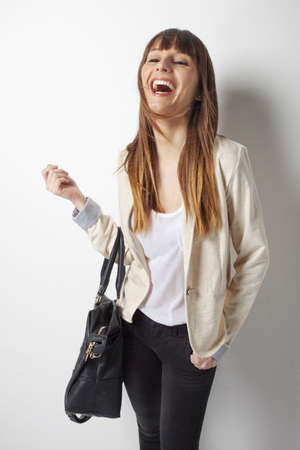 Beautiful business woman laughing on a white backgroundの写真素材