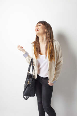 Beautiful business woman laughing on a white backgroundの写真素材