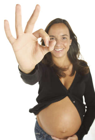 Attractive young pregnant woman isolated on whiteの写真素材