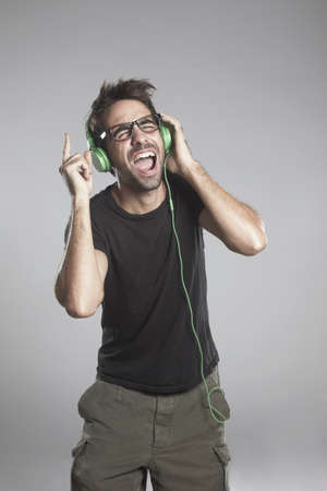 Young man listening musicの写真素材