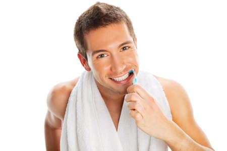 Man brushing teeth isolated on whiteの写真素材