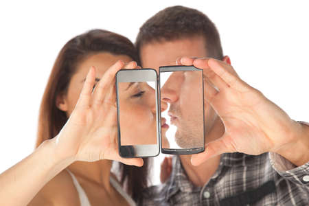 Young couple make photo on smartphone