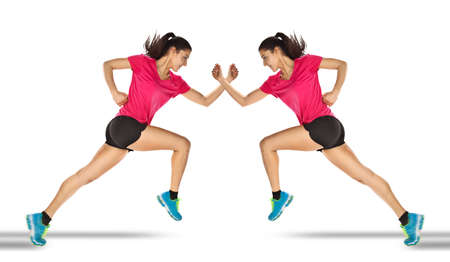 Young woman jogging front cement wall