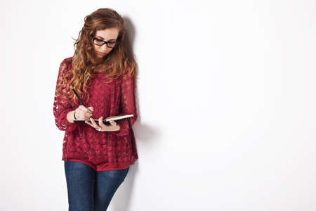 Portrait of a young woman over grey background