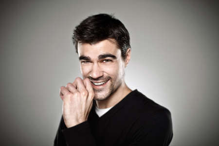 Attractive young man in studio looking at camera