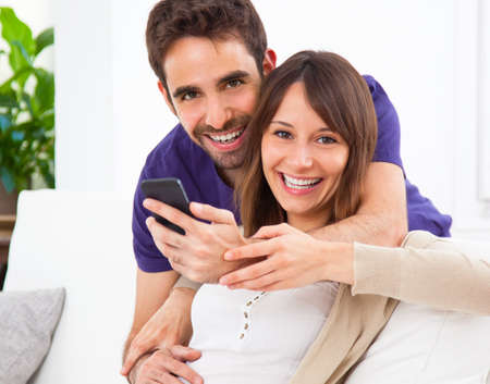 Happy young couple smilingの写真素材