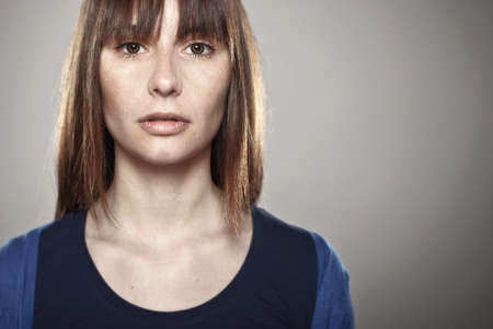 Beautiful young woman in studio looking at cameraの写真素材