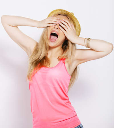Young woman with pink shirt in studio の写真素材