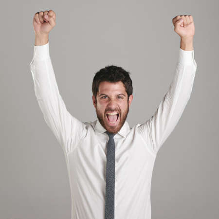 Young man lifting the hands and screaming.