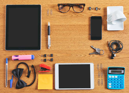 Diferent business objects on wooden desk の写真素材