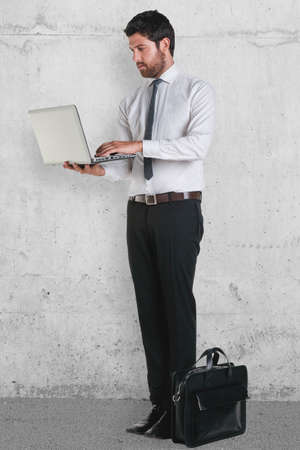 Businessman working on a grunge background の写真素材
