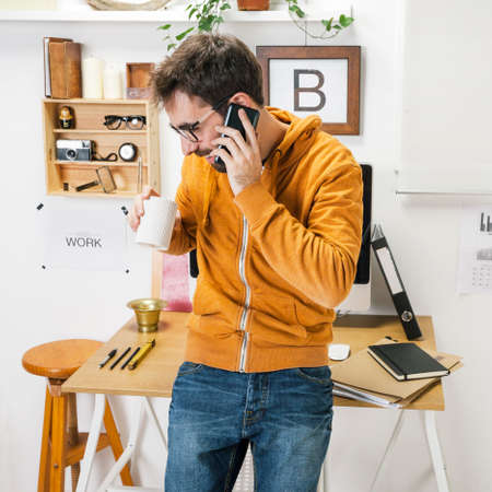creative entrepreneur on the phone in The office