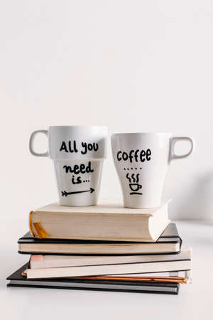 Hipster cup of coffee over a books の写真素材