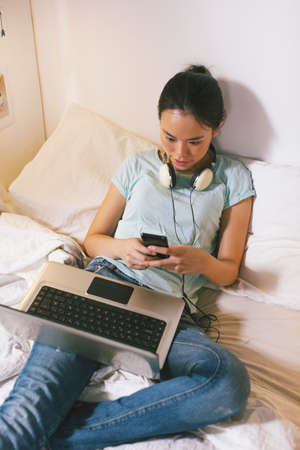 Beautiful asian woman using laptop computer.