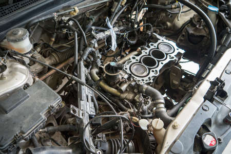 Fixing car engine using local method and simply tools found in local part of Thailandの写真素材