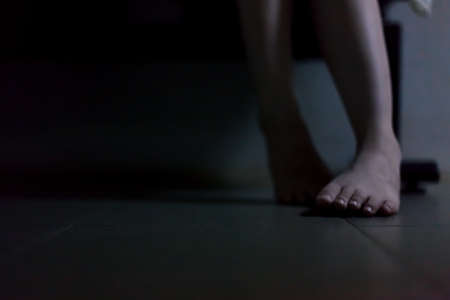 portrait of asian girl in white dress ready for halloween night,  low key pictureの写真素材