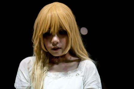 portrait of asian girl in white dress ready for halloween night,  low key picture
