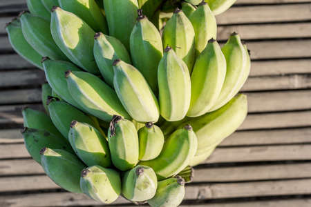 Unripe banana was cutted and wait to be eatenの写真素材