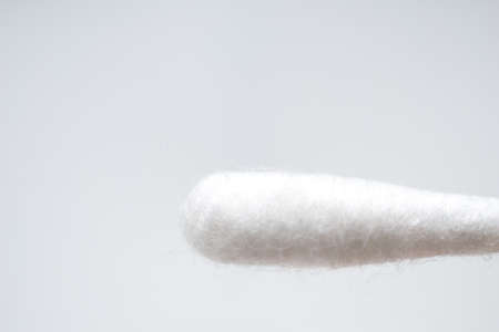 Tip of cotton bud on white backgroundの写真素材