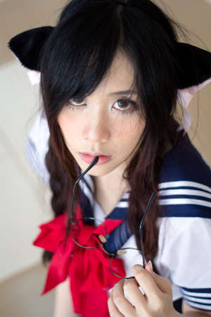 Asian school girl with charming eyesの写真素材