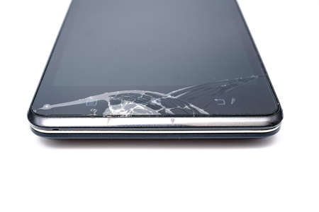 Broken screen on smartphone on white backgroundの写真素材