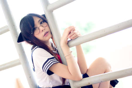 Asian school girl with charming eyesの写真素材