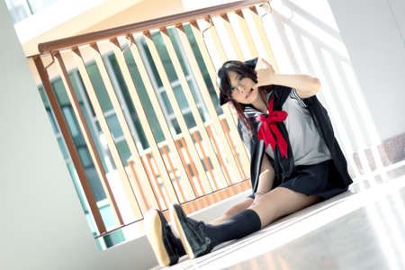 Asian school girl with charming eyesの写真素材